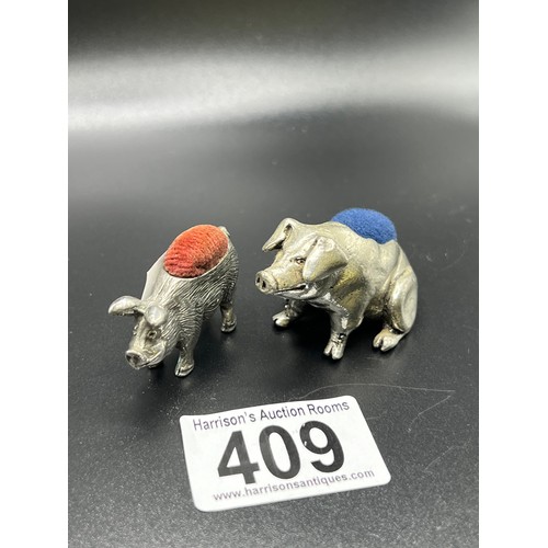 409 - 2 Pig white metal vintage pin cushions