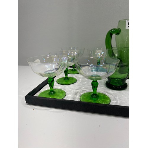 568 - Green glass jug & glasses tray not inc