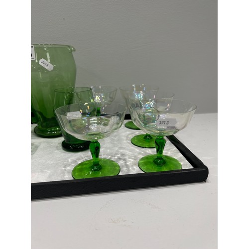 568 - Green glass jug & glasses tray not inc