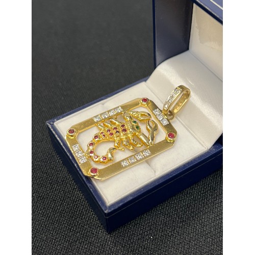 465X - 18ct Gold scorpion pendant having diamonds, emarlads, rubys 15.55g gross