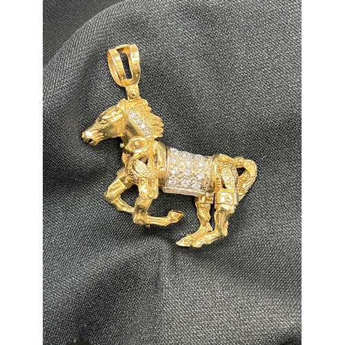 465U - 9ct Gold articulated horse pendant 58.8g gross