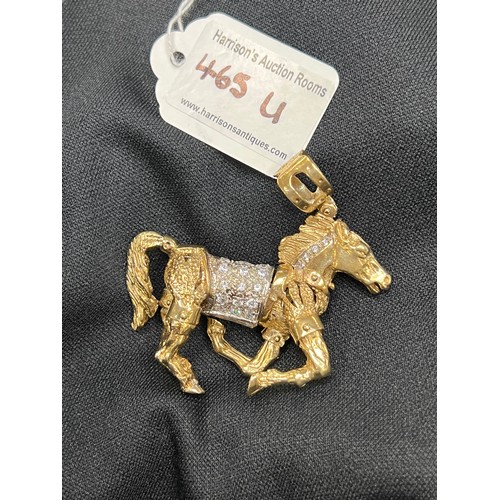 465U - 9ct Gold articulated horse pendant 58.8g gross