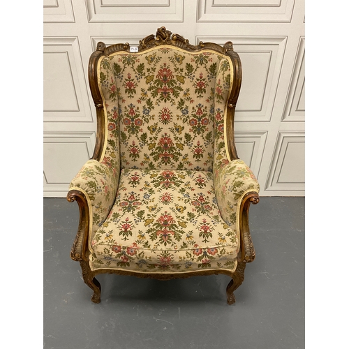 1267 - Edwardian carved wingback library chair with a subtle hint of guilt