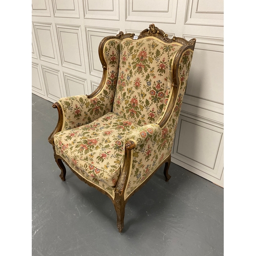 1267 - Edwardian carved wingback library chair with a subtle hint of guilt