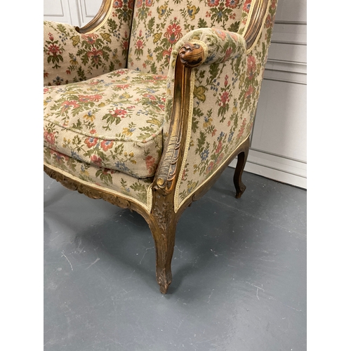 1267 - Edwardian carved wingback library chair with a subtle hint of guilt