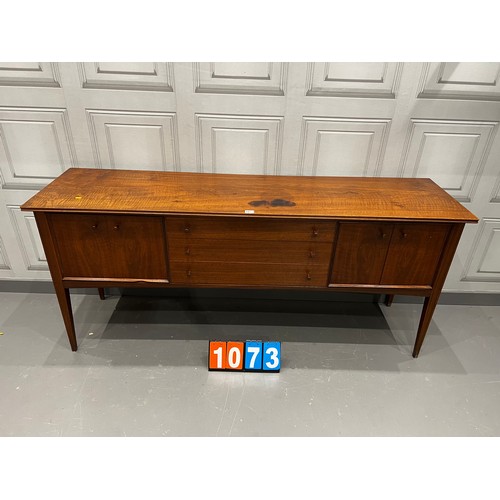 1073 - A Younger mid century teak sideboard