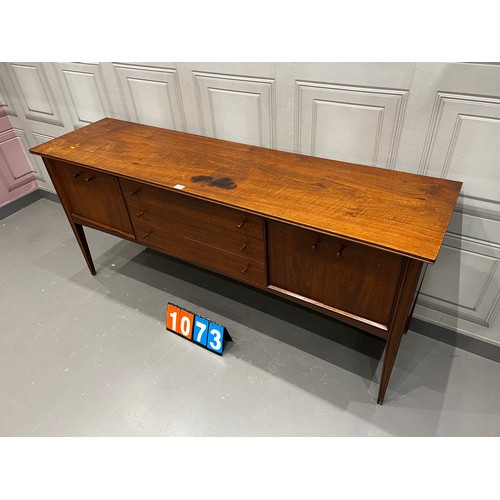 1073 - A Younger mid century teak sideboard