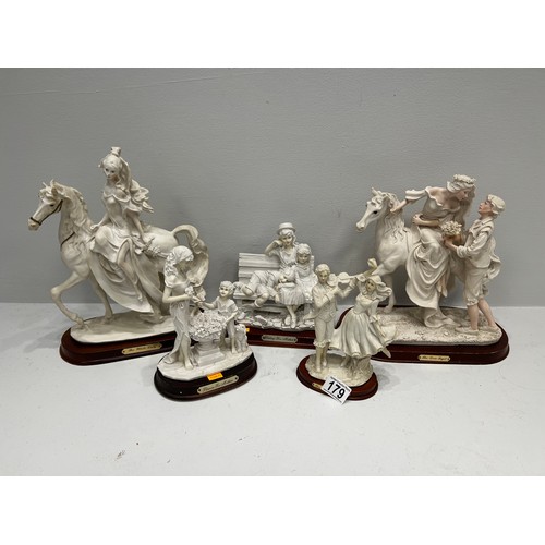 179 - 5 figures on wood stands