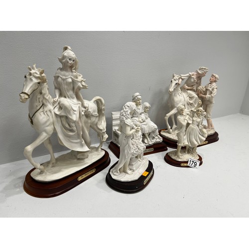 179 - 5 figures on wood stands