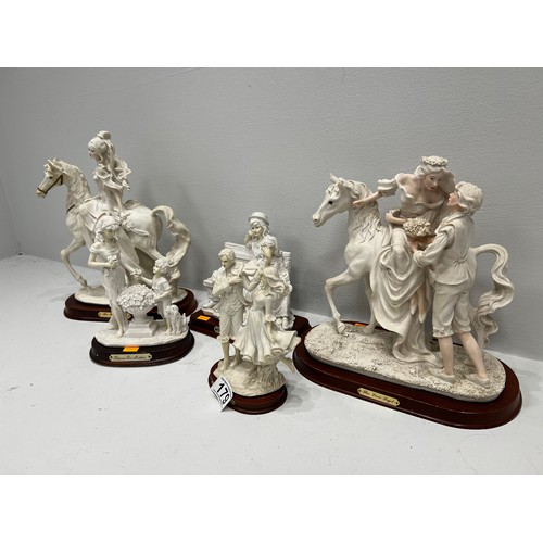 179 - 5 figures on wood stands