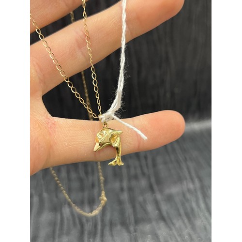 532 - 9ct Gold Dolphin Pendant on 9ct Gold chain 1.3g  20 “ long