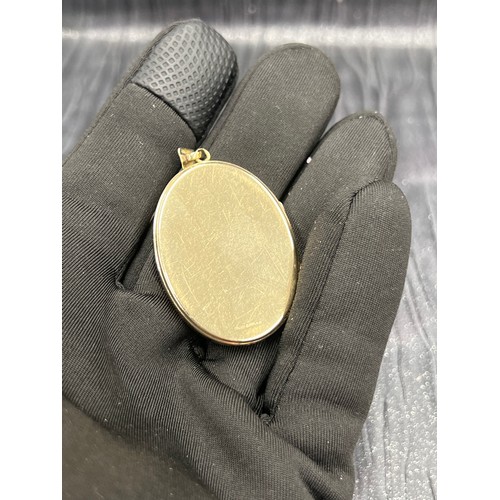 548 - 9ct gold locket 17.3g