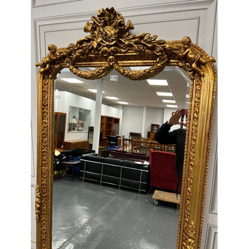 1178 - Large gilt cherub mirror 39