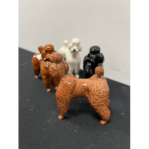 635 - 4 Beswick poodle dogs