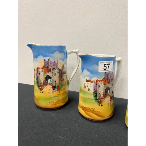 57 - 3 Vintage graduated jugs tower of london