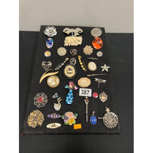 387 - Display assorted vintage silver etc brooches display not inc