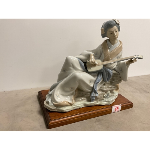 46 - NAO by Lladro ‘ Oriental Melody’ Porcelain figurine of geisha playing a Shamisen figurine on a Woode... 