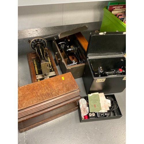 648 - Three vintage singer sewing machines all in original cases