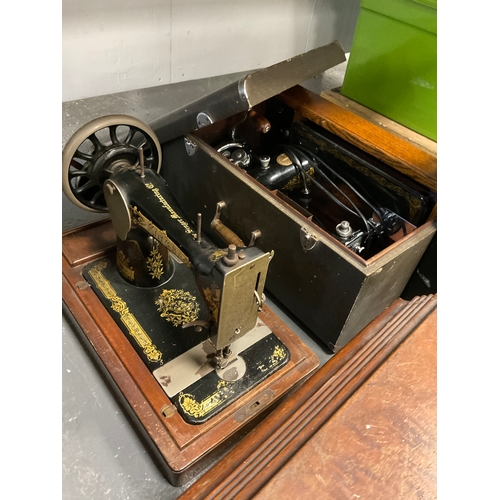 648 - Three vintage singer sewing machines all in original cases