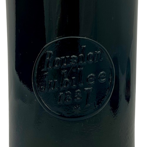 103 - A rare Rickets Patent 'Rousdon Jubilee 1887' dark olive green sealed wine bottle, with high kick bas... 