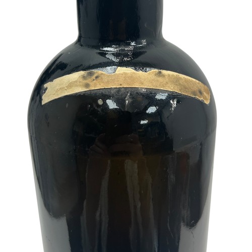 103 - A rare Rickets Patent 'Rousdon Jubilee 1887' dark olive green sealed wine bottle, with high kick bas... 