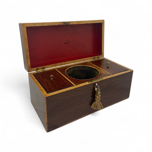 220 - A mid 19th century partridge wood double compartment tea caddy with boxwood stringing. Shield shaped... 