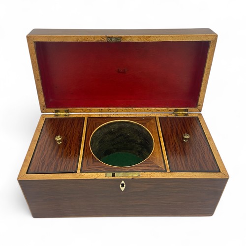 220 - A mid 19th century partridge wood double compartment tea caddy with boxwood stringing. Shield shaped... 