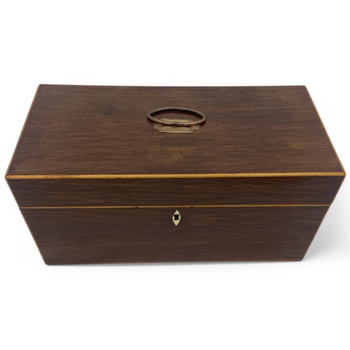 220 - A mid 19th century partridge wood double compartment tea caddy with boxwood stringing. Shield shaped... 