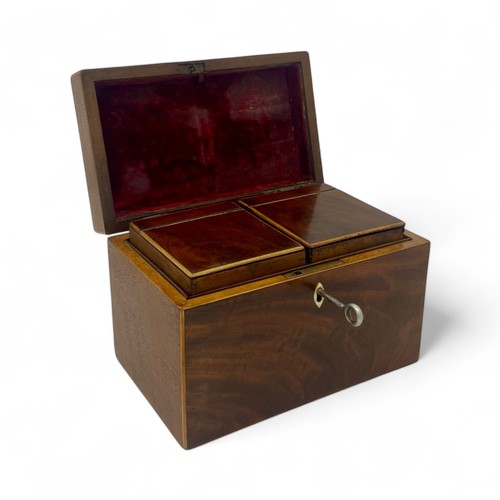 219 - A mid-19th century mahogany tea caddy with boxwood stringing. Working lock and key (key is a replace... 