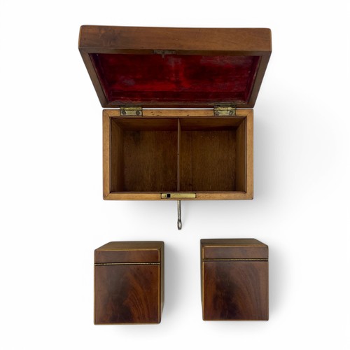 219 - A mid-19th century mahogany tea caddy with boxwood stringing. Working lock and key (key is a replace... 