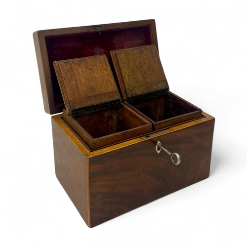 219 - A mid-19th century mahogany tea caddy with boxwood stringing. Working lock and key (key is a replace... 