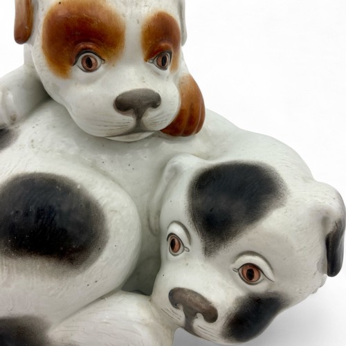 23 - A charming late 19th century Royal Worcester figural group of a pair of dogs or puppies, c1885, afte... 