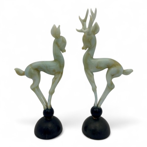 109 - A pair of 1950s Art Deco style Istvan Komaromy studio glass deer, the lampworked opaque greeny-cream... 