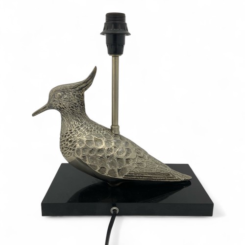 226 - A mid-late 20th century plated metal table lampbase, in the form of a Lapwing bird, mounted on a bla... 