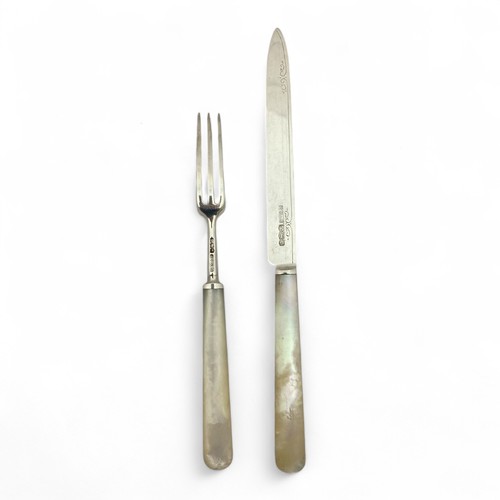 129 - A set of twelve 1930s Art Deco silver bladed dessert fruit knives or forks, with faux mother of pear... 