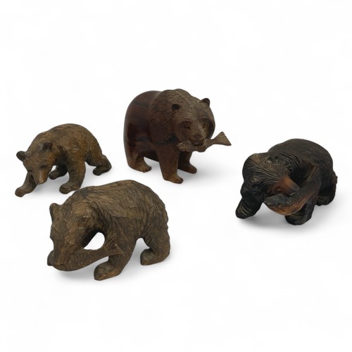 253 - Four early 20th century Black Forest, or Black Forest-style, carved bears, the largest carved from a... 