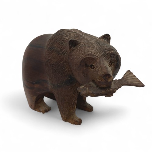 253 - Four early 20th century Black Forest, or Black Forest-style, carved bears, the largest carved from a... 