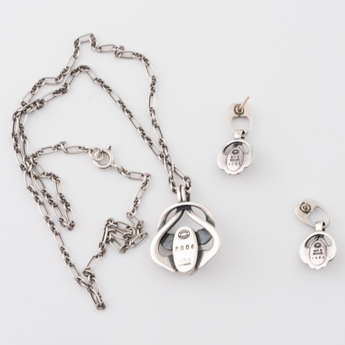 138 - A Danish Georg Jensen white metal Heritage Collection 'Year' pendant with a chain and matching earri... 