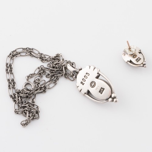 141 - A Danish Georg Jensen white metal Heritage Collection 'Year' pendant with a chain, 2003, modelled wi... 