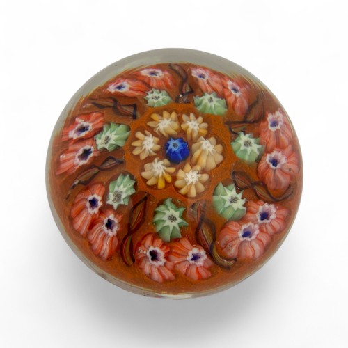 74 - Five large Strathearn P.7 millefiori dome paperweights, with orange, red, dark blue and black ground... 