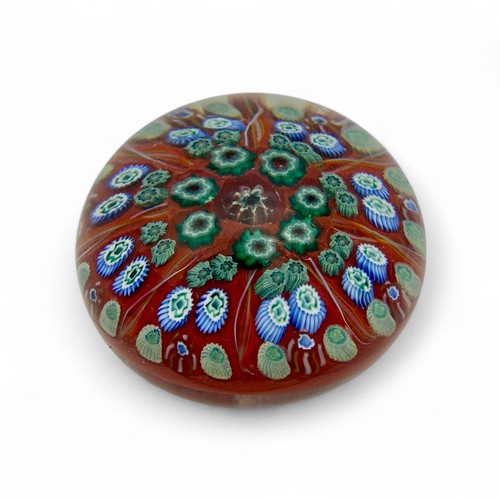 74 - Five large Strathearn P.7 millefiori dome paperweights, with orange, red, dark blue and black ground... 