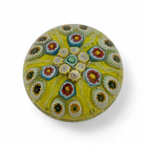 72 - Four medium Strathearn P.8 millefiori dome paperweights, with yellow green and orange grounds, diame... 