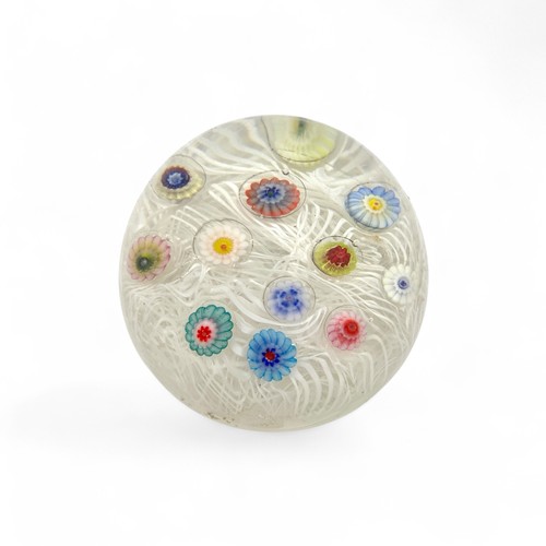 71 - Four Strathearn medium paperweights, spaced millefiori canes on lace ground, largest 7.3cm diameter ... 