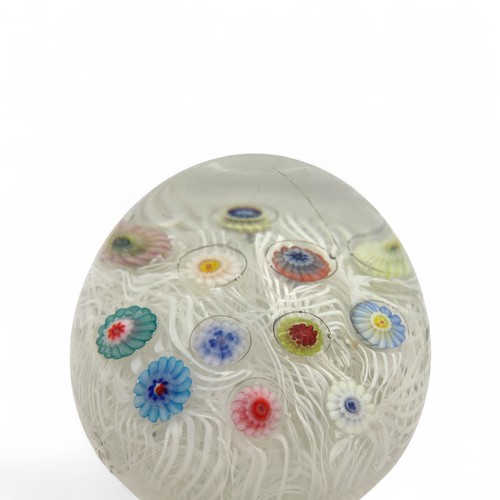 71 - Four Strathearn medium paperweights, spaced millefiori canes on lace ground, largest 7.3cm diameter ... 