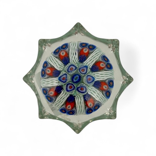 78 - Five medium Strathearn eight spoke radial star moulded millefiori paperweights, with black, blue and... 