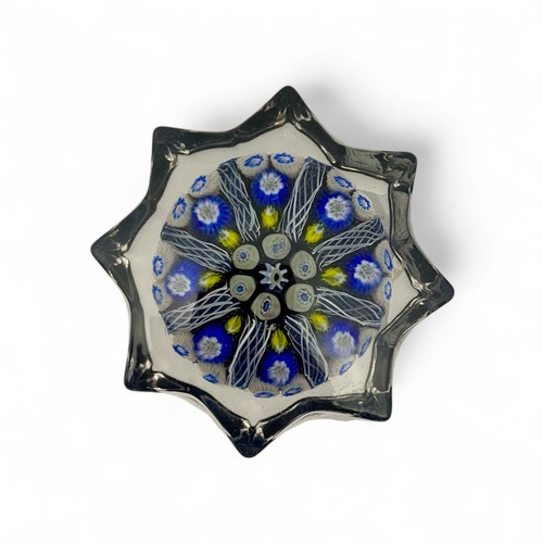 78 - Five medium Strathearn eight spoke radial star moulded millefiori paperweights, with black, blue and... 