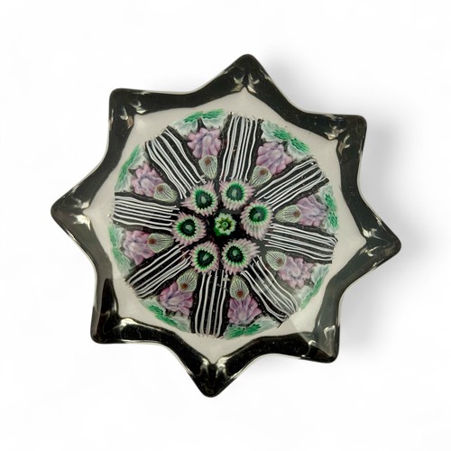 78 - Five medium Strathearn eight spoke radial star moulded millefiori paperweights, with black, blue and... 