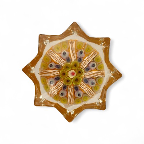 70 - Four medium Strathearn radial star moulded radial millefiori paperweights, one nine spoke and three ... 