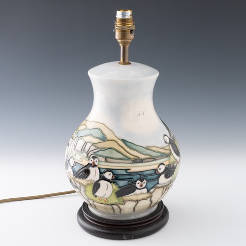 27 - A Large Moorcroft ‘Puffin’ pattern baluster table lamp with glued wooden base, designed by Carol Lov... 