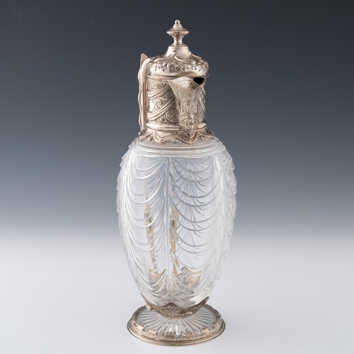 115 - A Victorian silver-mounted cut glass claret jug, the body with graduated, sloping festoon-type curvi... 